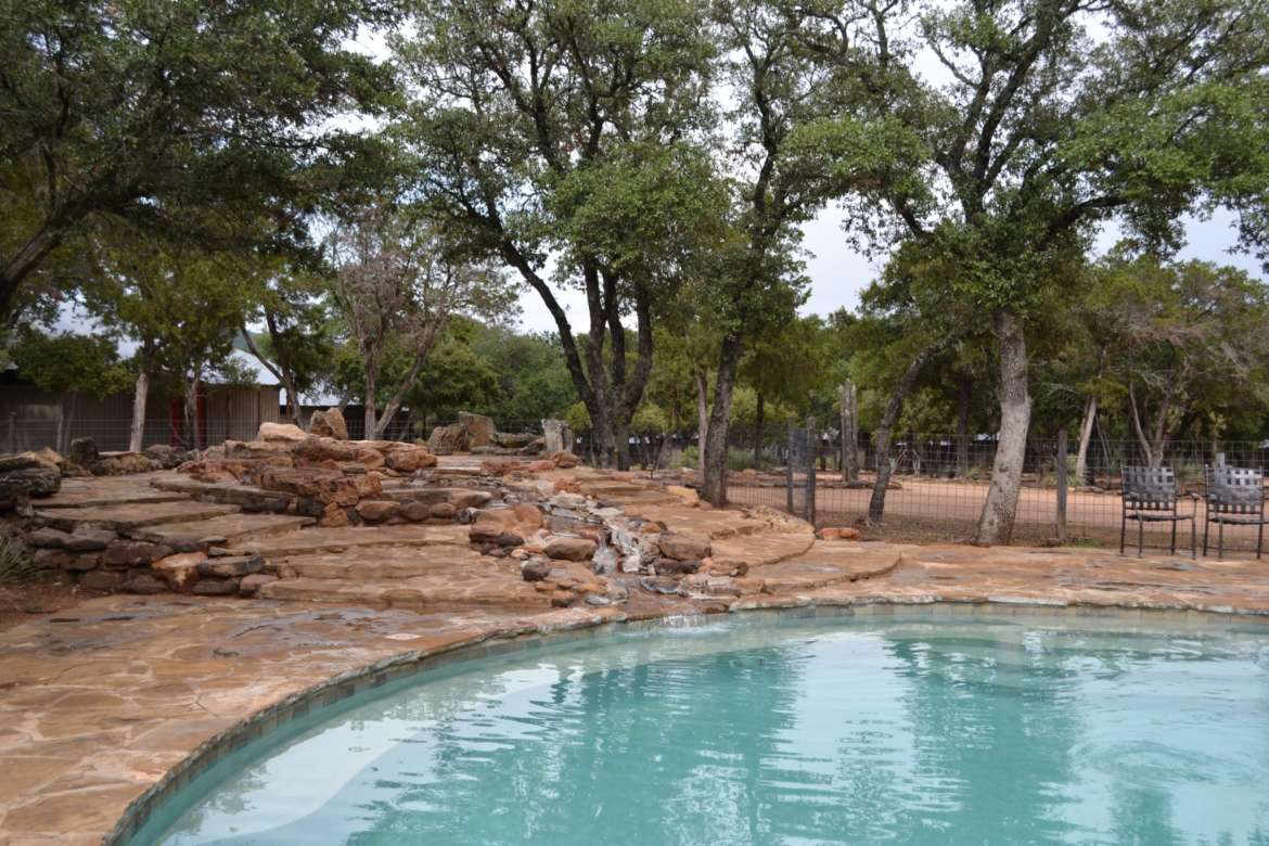 Swimming pool with stone waterfall at Canyon of the Eagles resort and nature park. Photo by Pamela McKuen