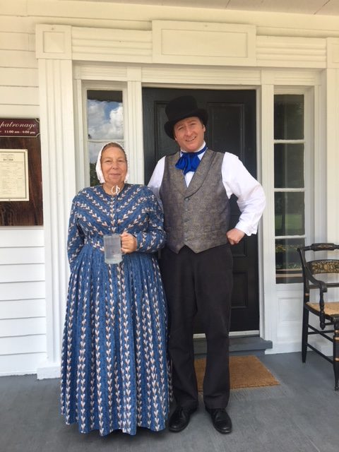 Costumed interpreters waiting to serve you at Eagle Tavern.