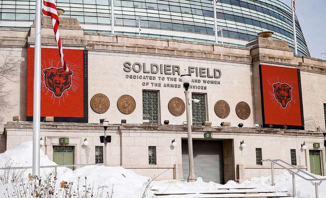Franchise relocation article featured image of the outside of Soldier Field covered in snow.
