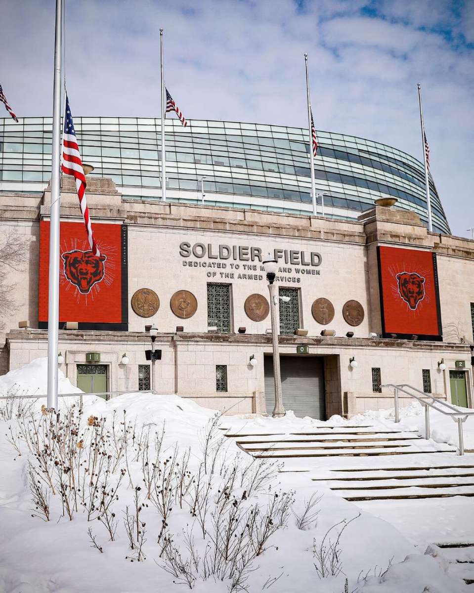 Franchise relocation article featured image of the outside of Soldier Field covered in snow.