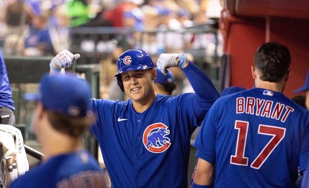 Former Chicago Cub, Anthony Rizzo, high-fiving teammates in the dougout.