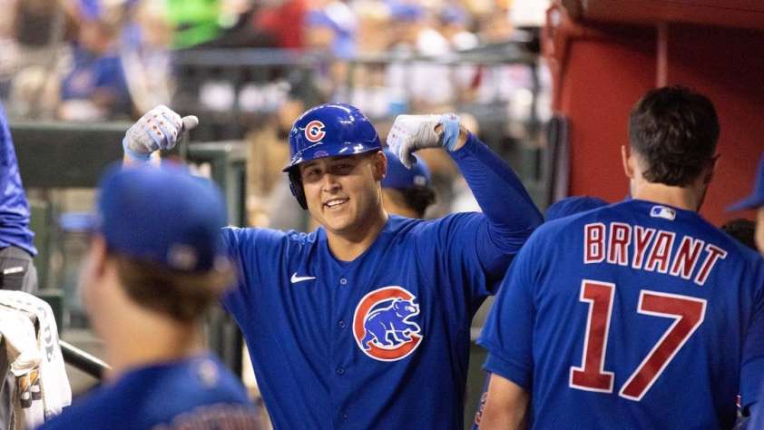 Former Chicago Cub, Anthony Rizzo, high-fiving teammates in the dougout.