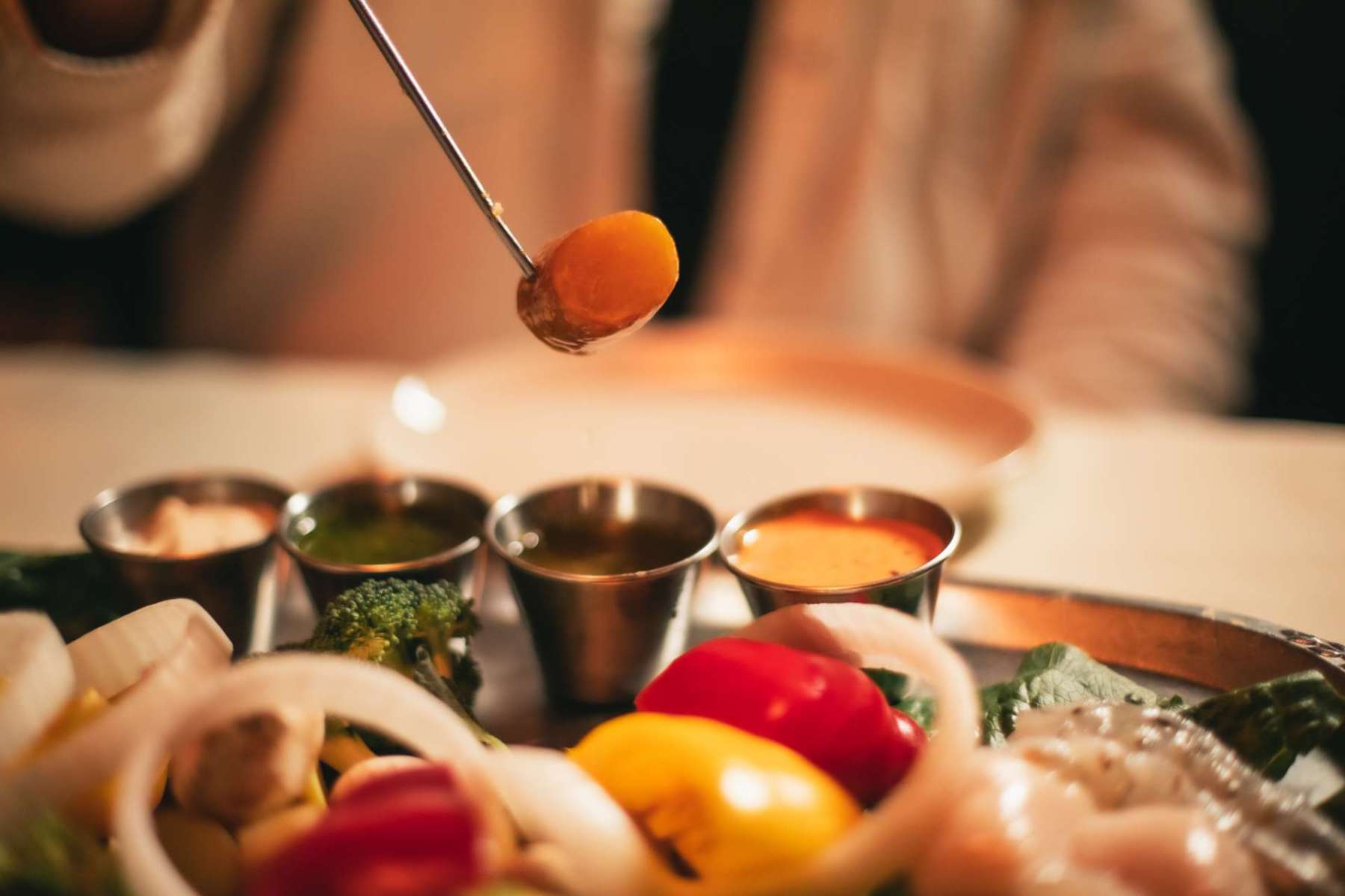things to do in Chicago this June fondue pot dipping sauce flight