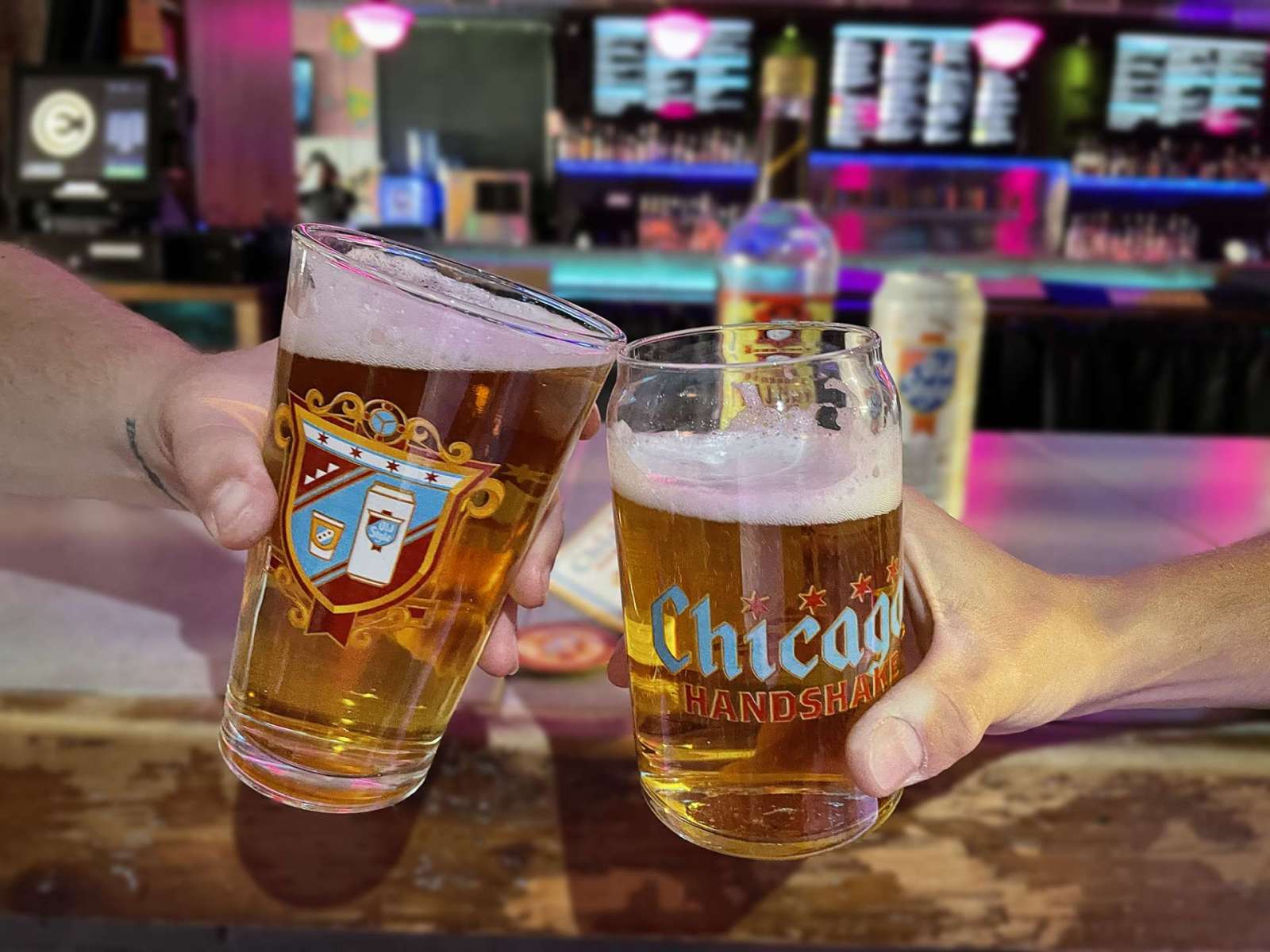 two people raising glass chicago handshake passport