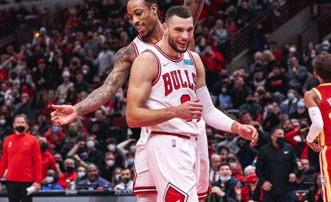 Chicago Bulls news post featured image of DeMar DeRozan and Zach LaVine celebrating.