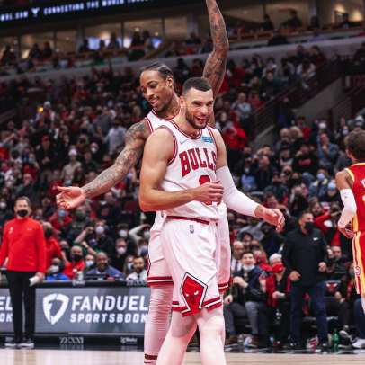 Chicago Bulls news post featured image of DeMar DeRozan and Zach LaVine celebrating.