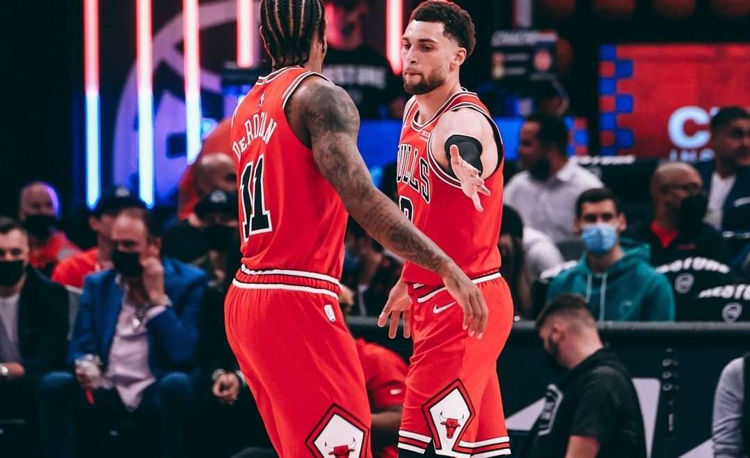 Chicago Bulls Preseason featured image of Zach LaVine and DeMar DeRozan high-fiving.