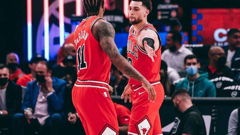 Chicago Bulls Preseason featured image of Zach LaVine and DeMar DeRozan high-fiving.
