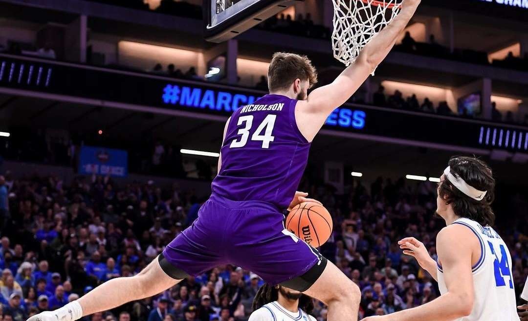 Featured image for March Madness upsets blog of a Northwestern player dunking in a 2023 tournament game versus UCLA.