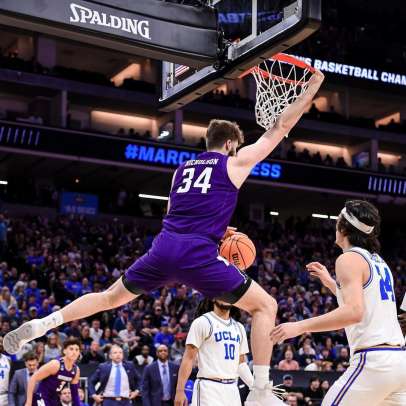 Featured image for March Madness upsets blog of a Northwestern player dunking in a 2023 tournament game versus UCLA.