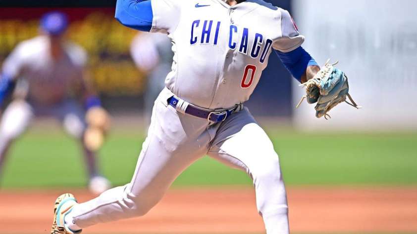 Chicago Cubs pitcher Marcus Stroman mid-windup.