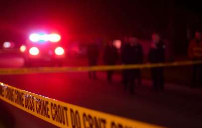 Police lights at night and crime scene tape