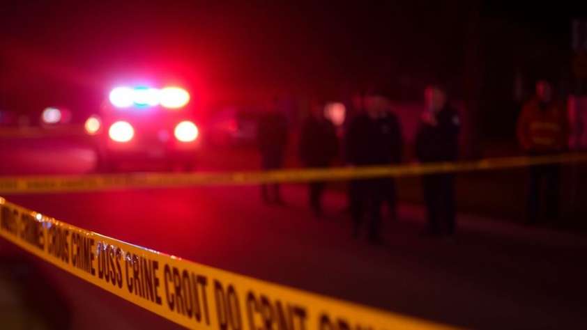 Police lights at night and crime scene tape