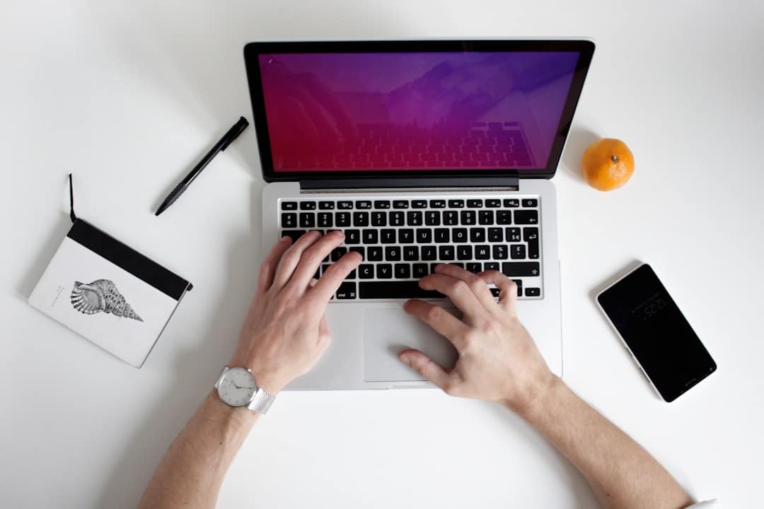 Businessman at RFP management firm using laptop