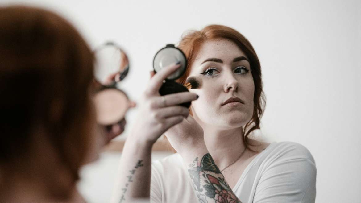 Woman applying make up