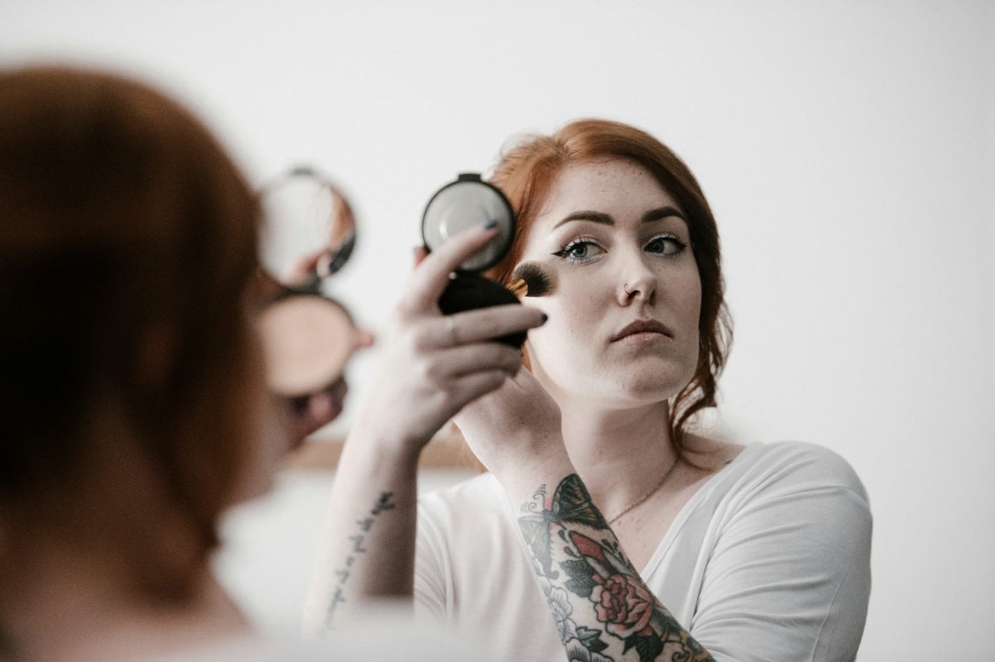 Woman applying make up