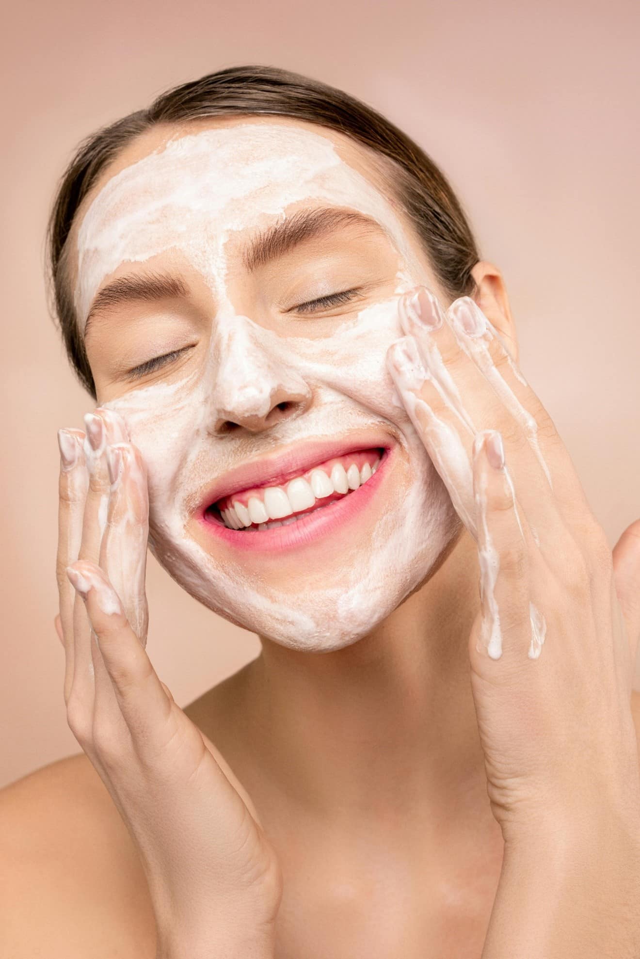 Woman using sunscreen