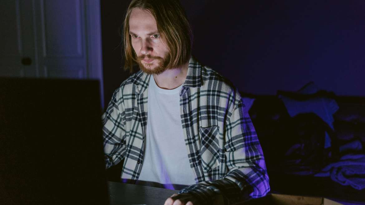 Man browsing on laptop