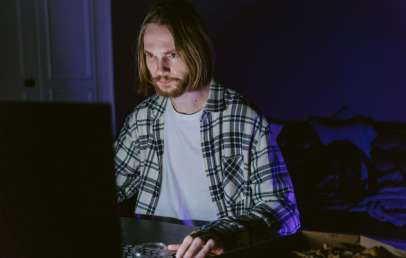 Man browsing on laptop