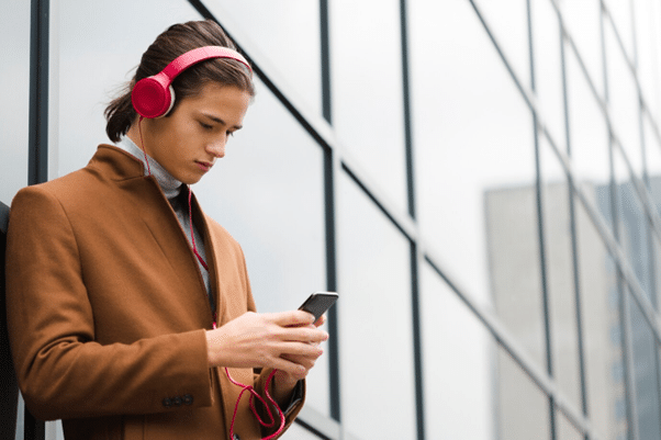 Man holding phone and listening to music