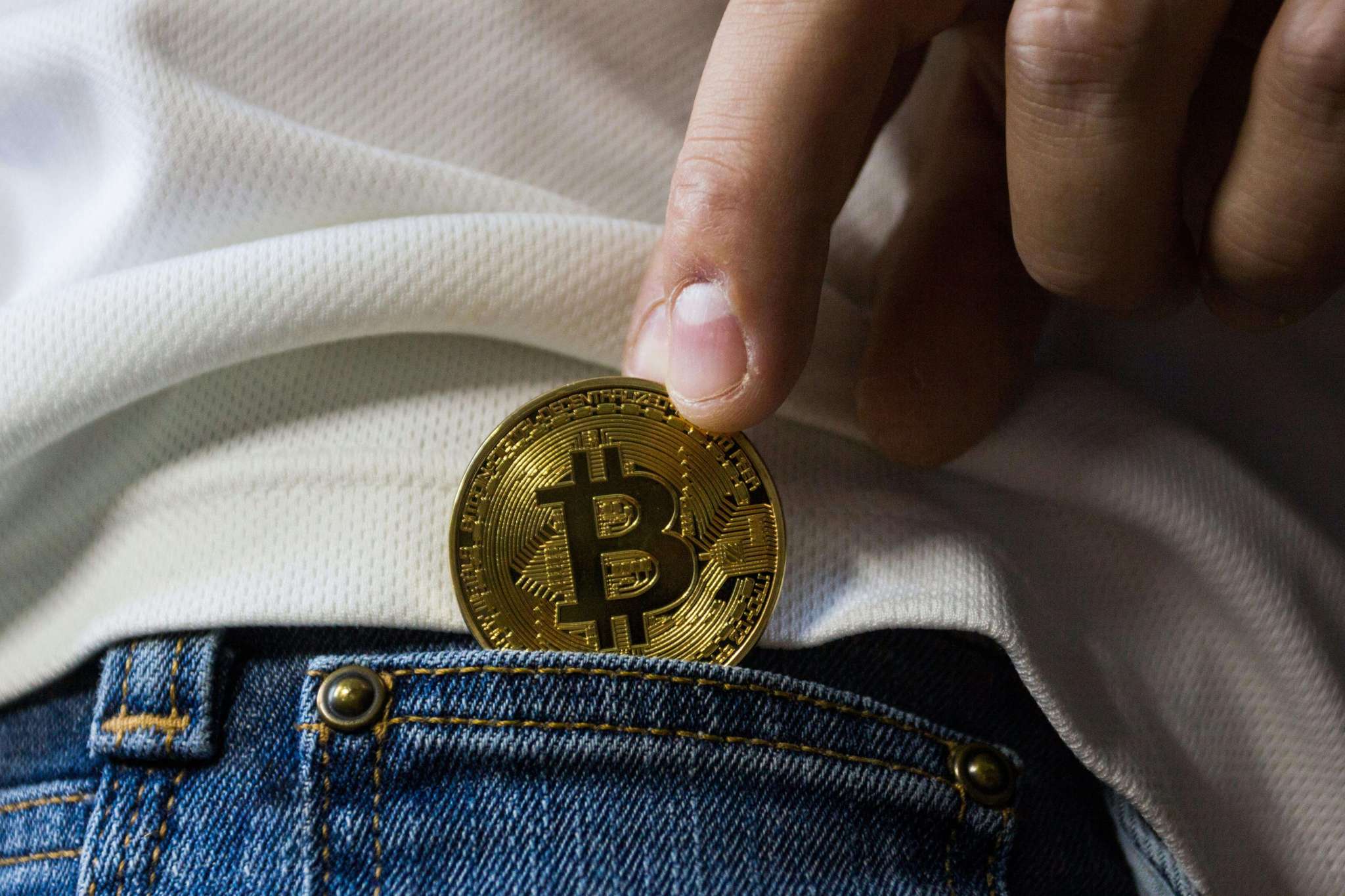 Bitcoin in the pocket of jeans