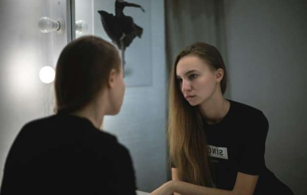 Woman looking in the mirror