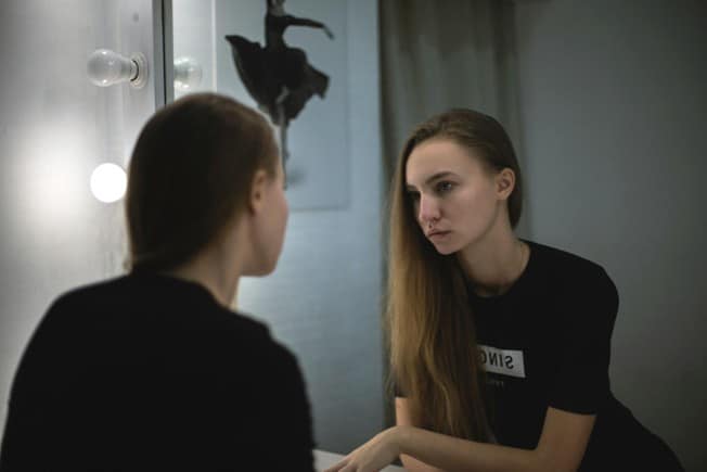 Woman looking in the mirror