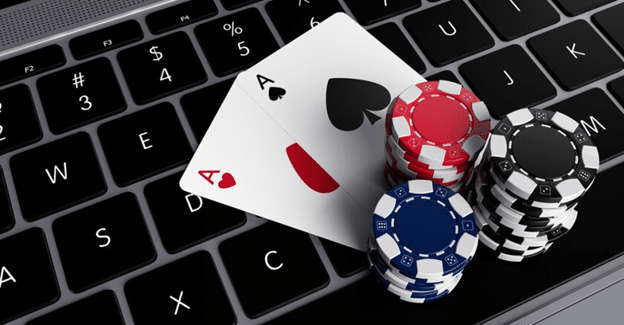 Poker Chips and Cards on laptop keyboard