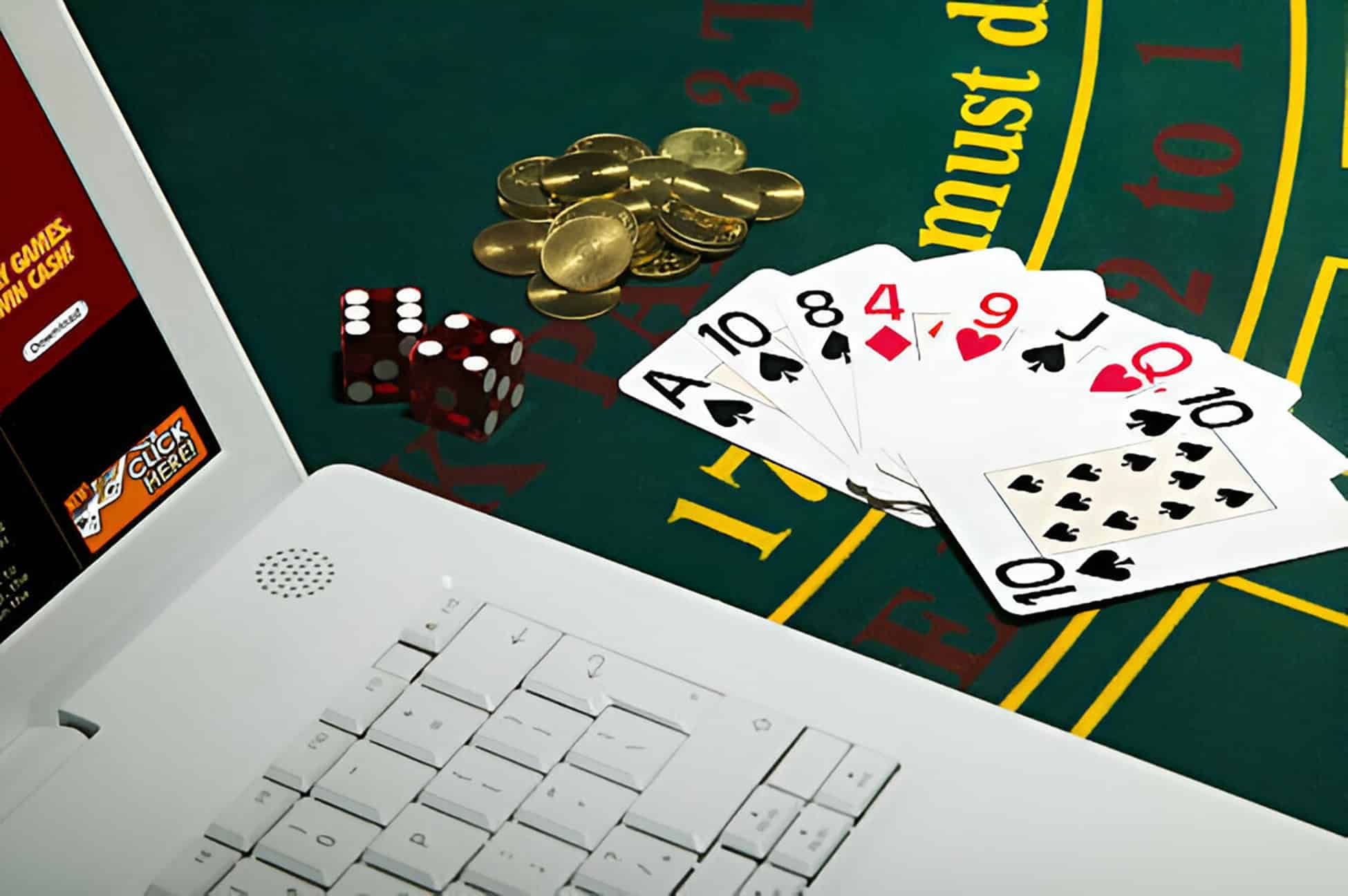 Poker cards and Laptop on table