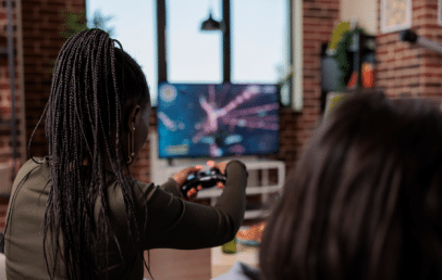 2 Teenagers Playing video game