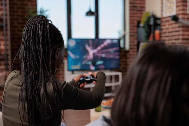 2 Teenagers Playing video game