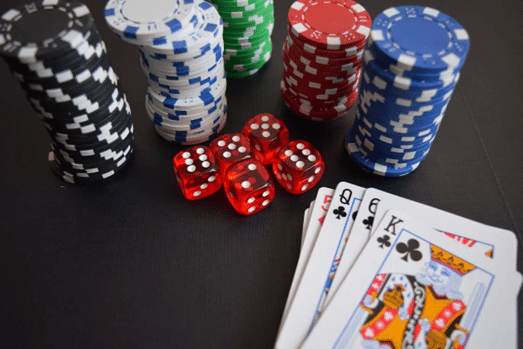 Poker Chips and Cards on the table with dices