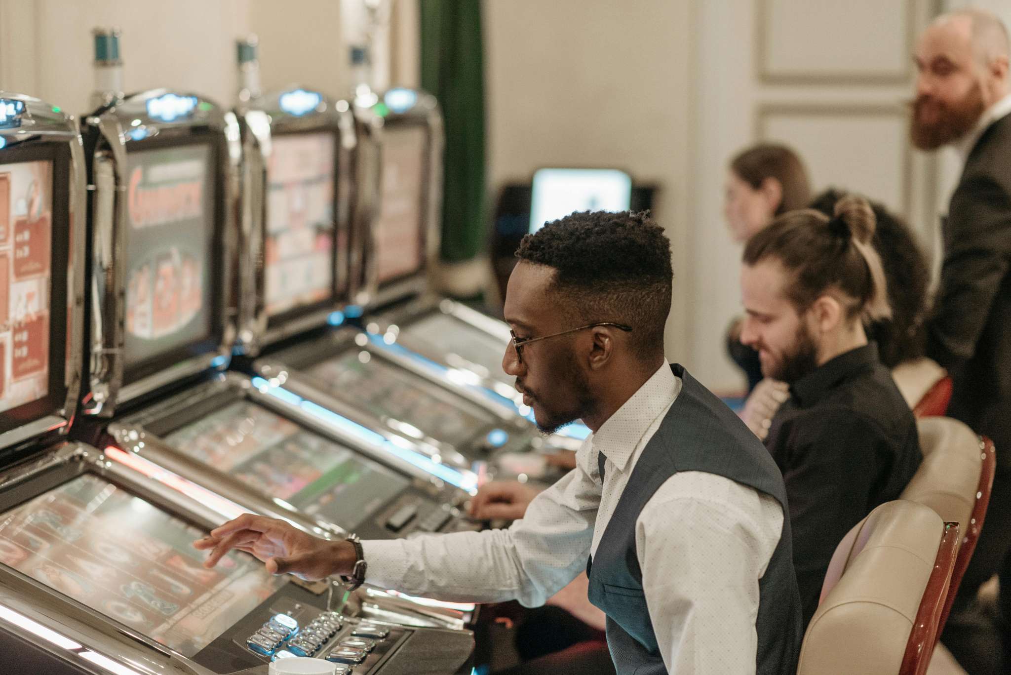 Man Playing Slots in a Urban Casino