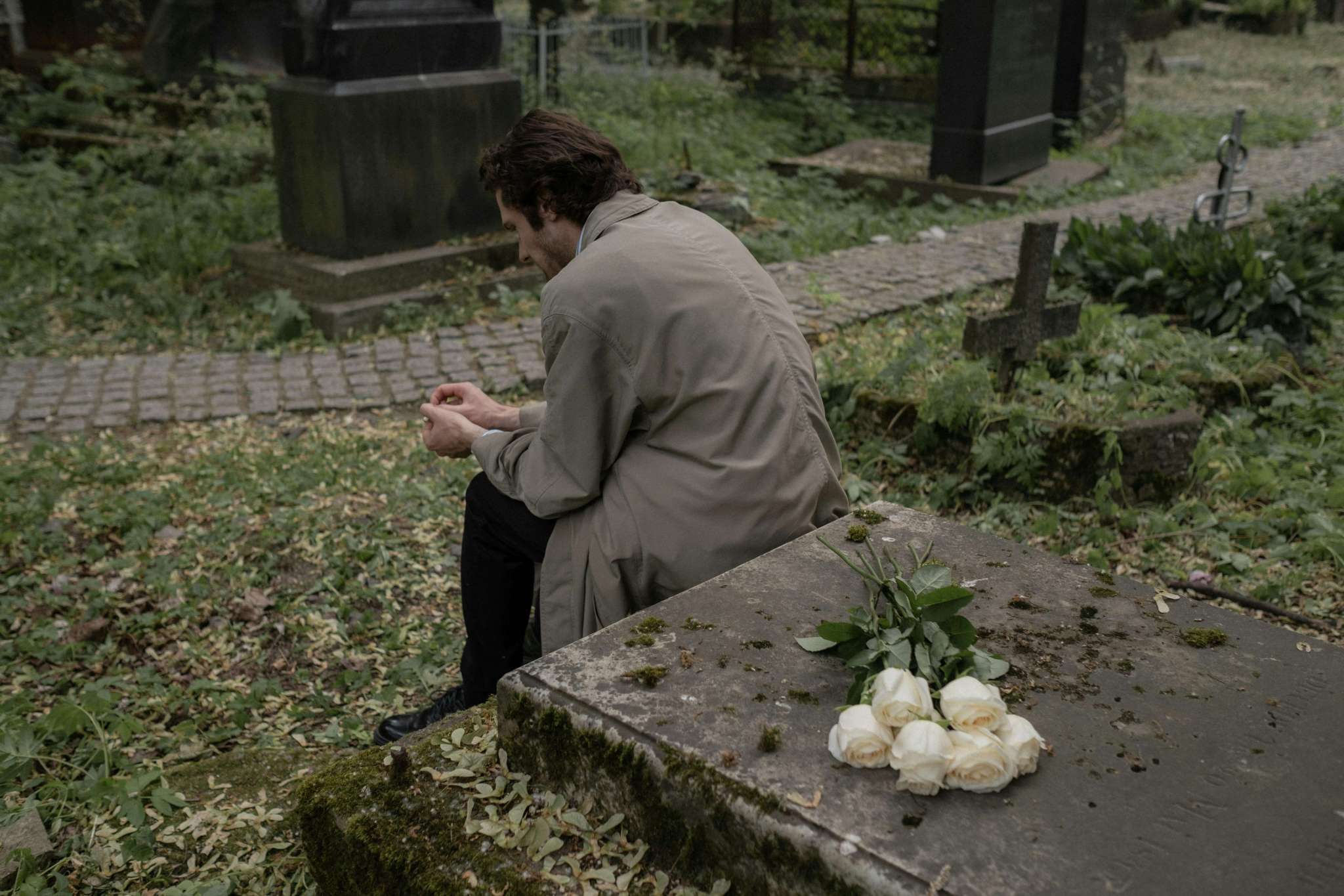 Man sitting at grave