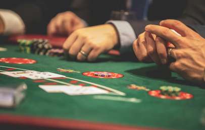Hands on poker table