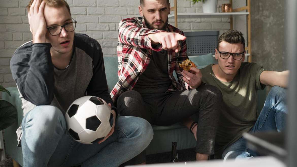 Friends watching soccer game