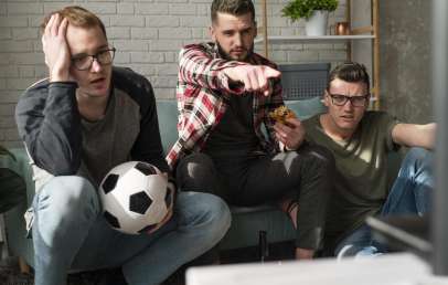 Friends watching soccer game